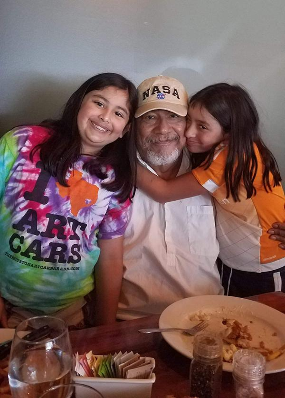 Sandoval pictured with two of his five granddaughters. (Photo credit: Monica Sandoval)